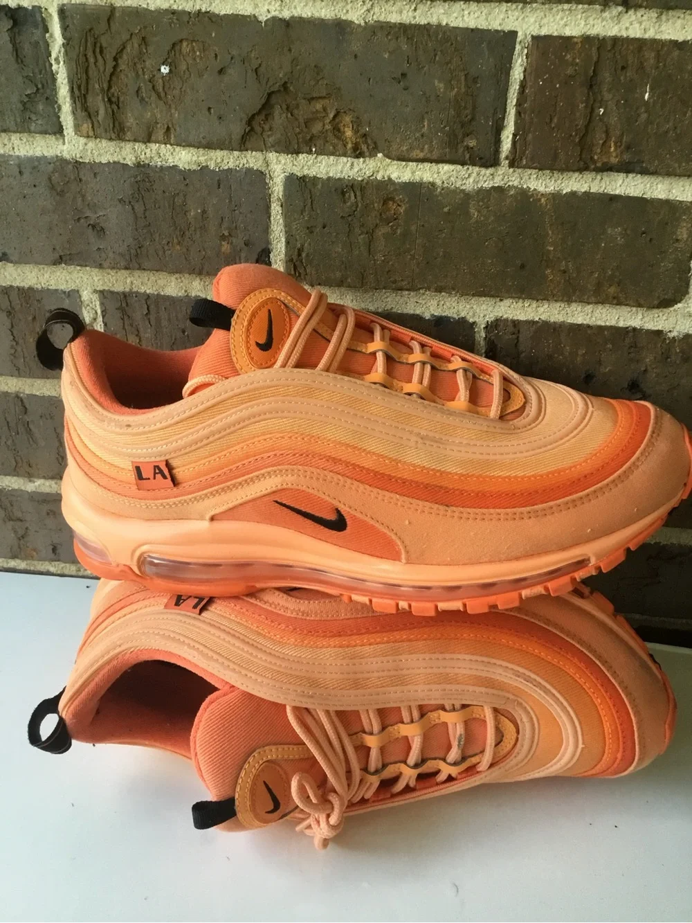 Nike Women’s Air Max 97 in Orange and Coral